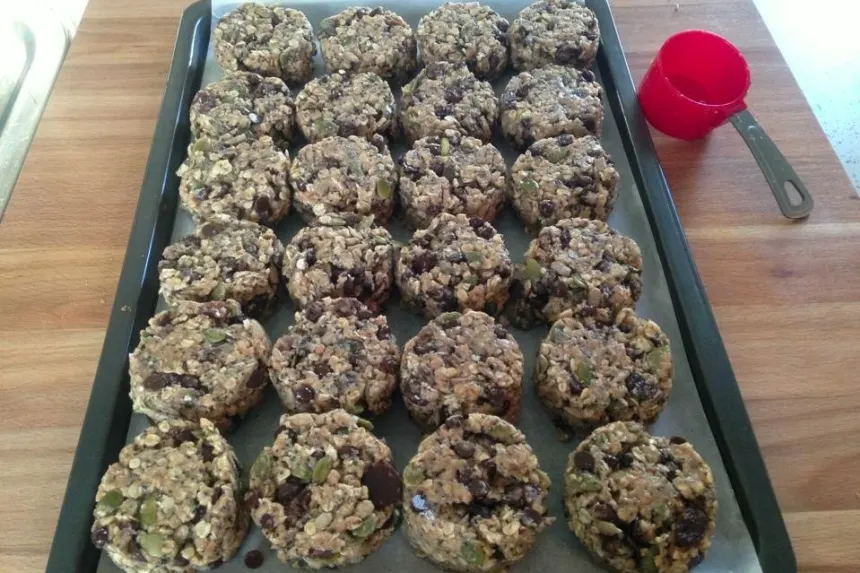 A tray full of Cosmic Cookie Recipe oat cookies on a counter at Planet Organic.